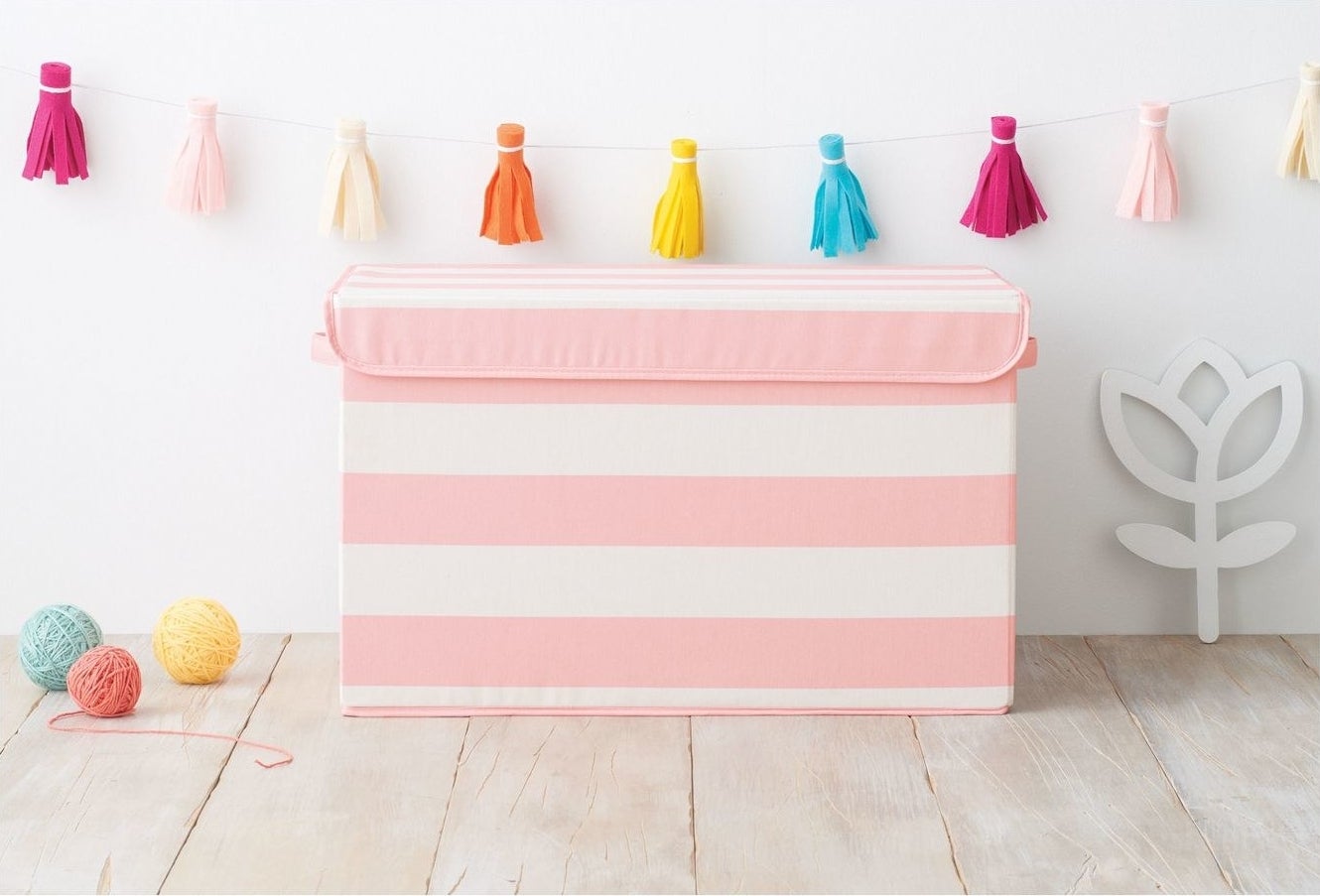 pink striped bin for storing toys