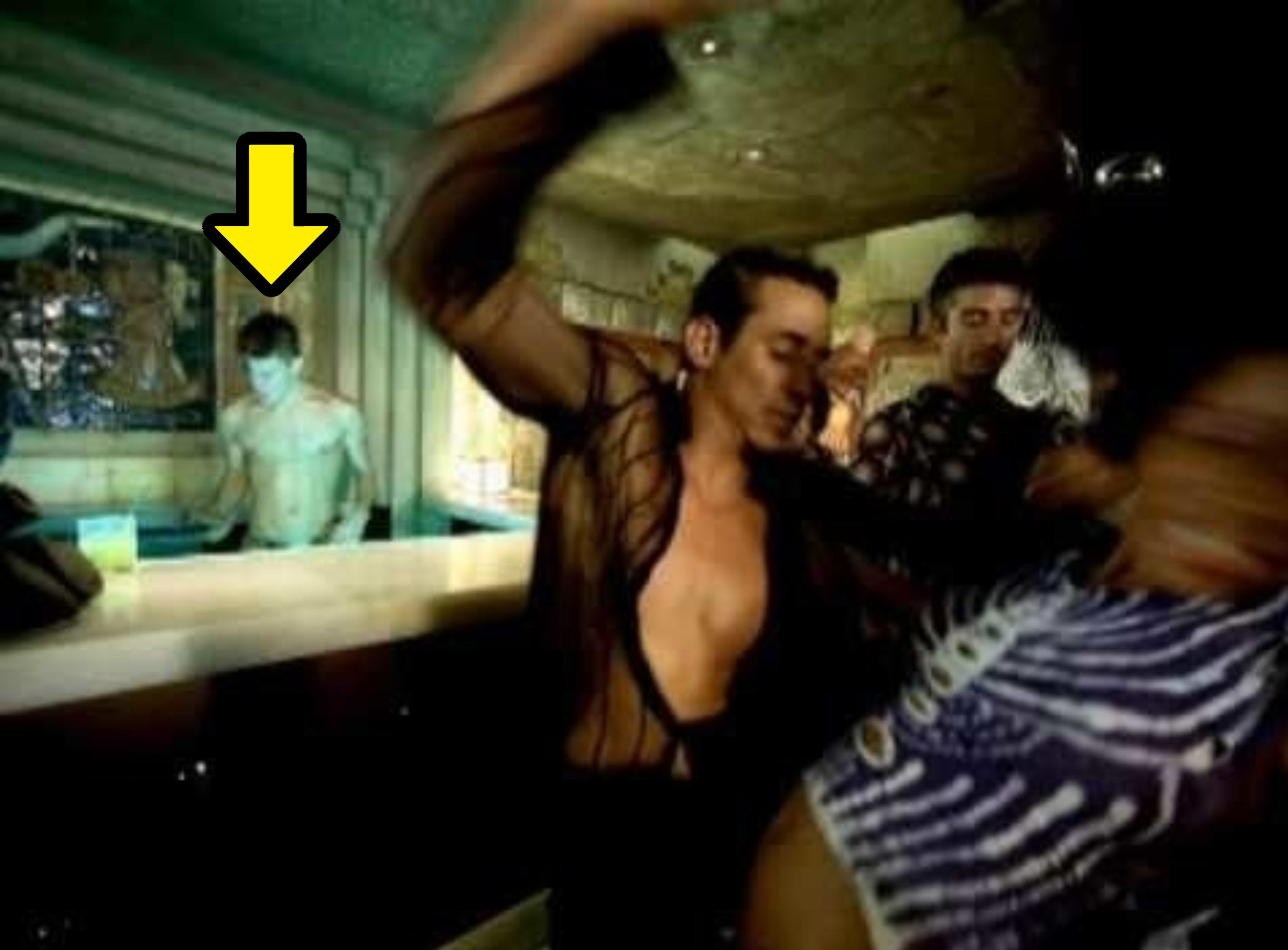 Channing shirtless behind the bar as Ricky dances