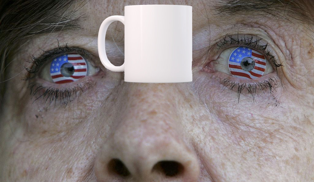 Woman with American flag contacts looking at a mug