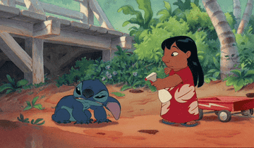 LIlo spraying Stitch with a bottle of water as he grimaces
