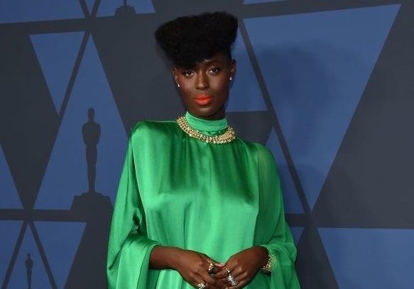 Jodie Turner-Smith posing in a gown at the Oscars