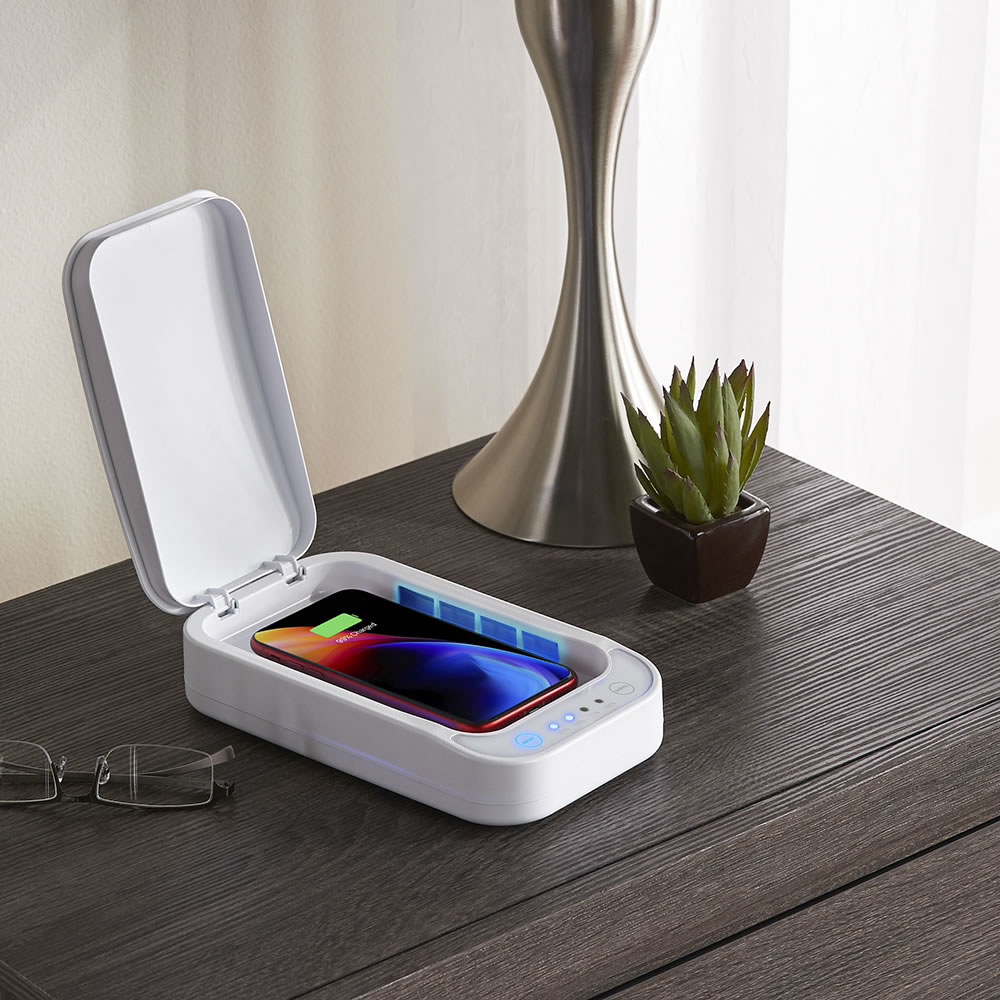 An iPhone sits inside a 10 Minute Smartphone Sanitizer