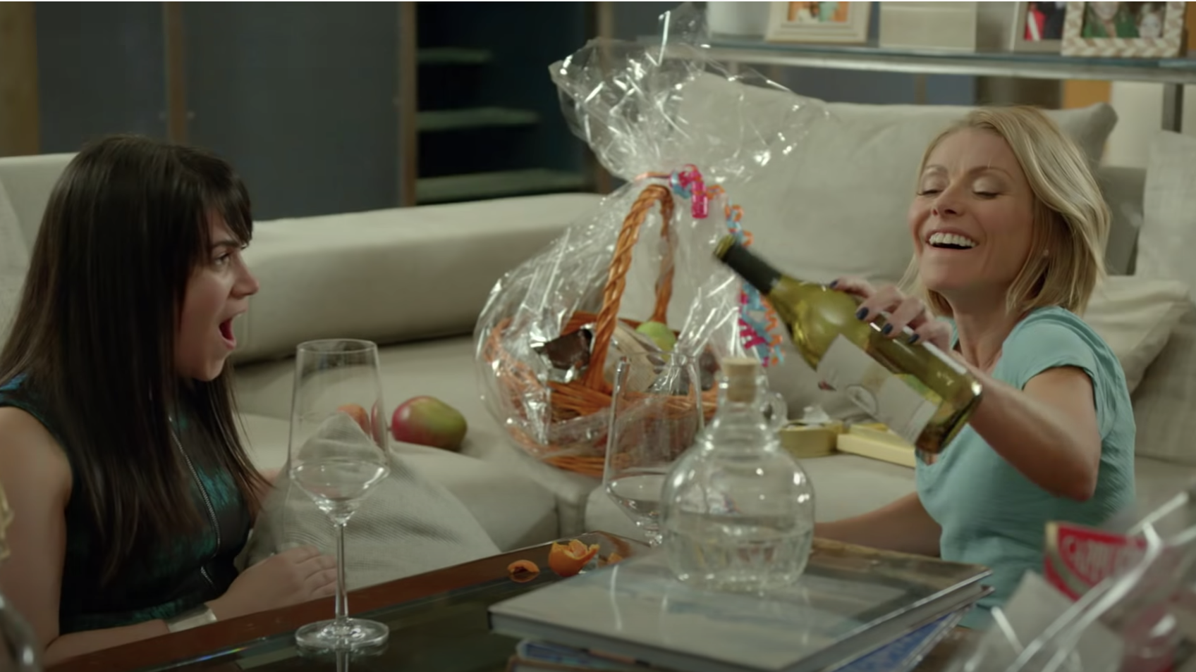 A drunk Kelly Ripa pours wine on Broad City