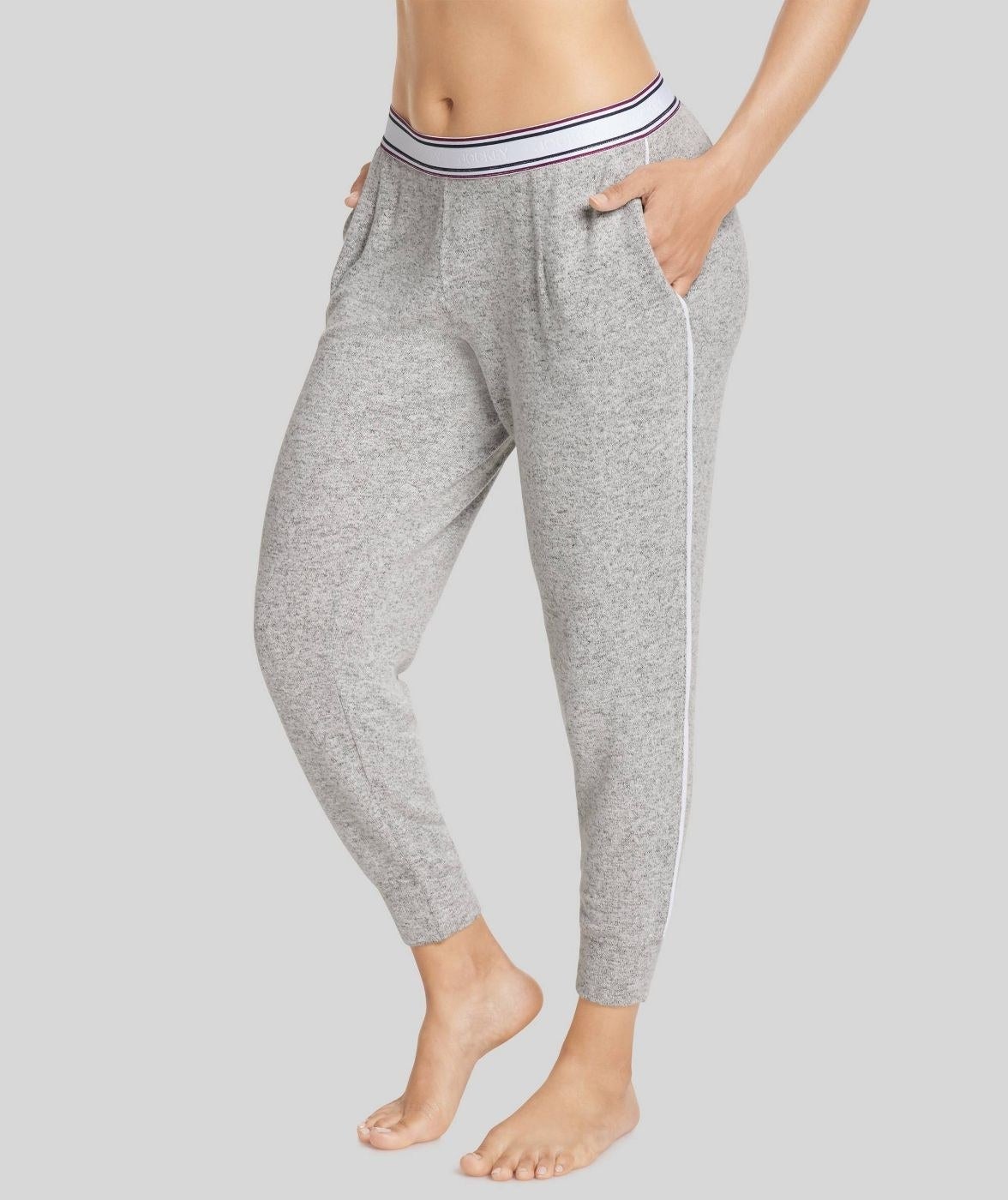 model wearing the gray jogger pants with pockets and white waistband