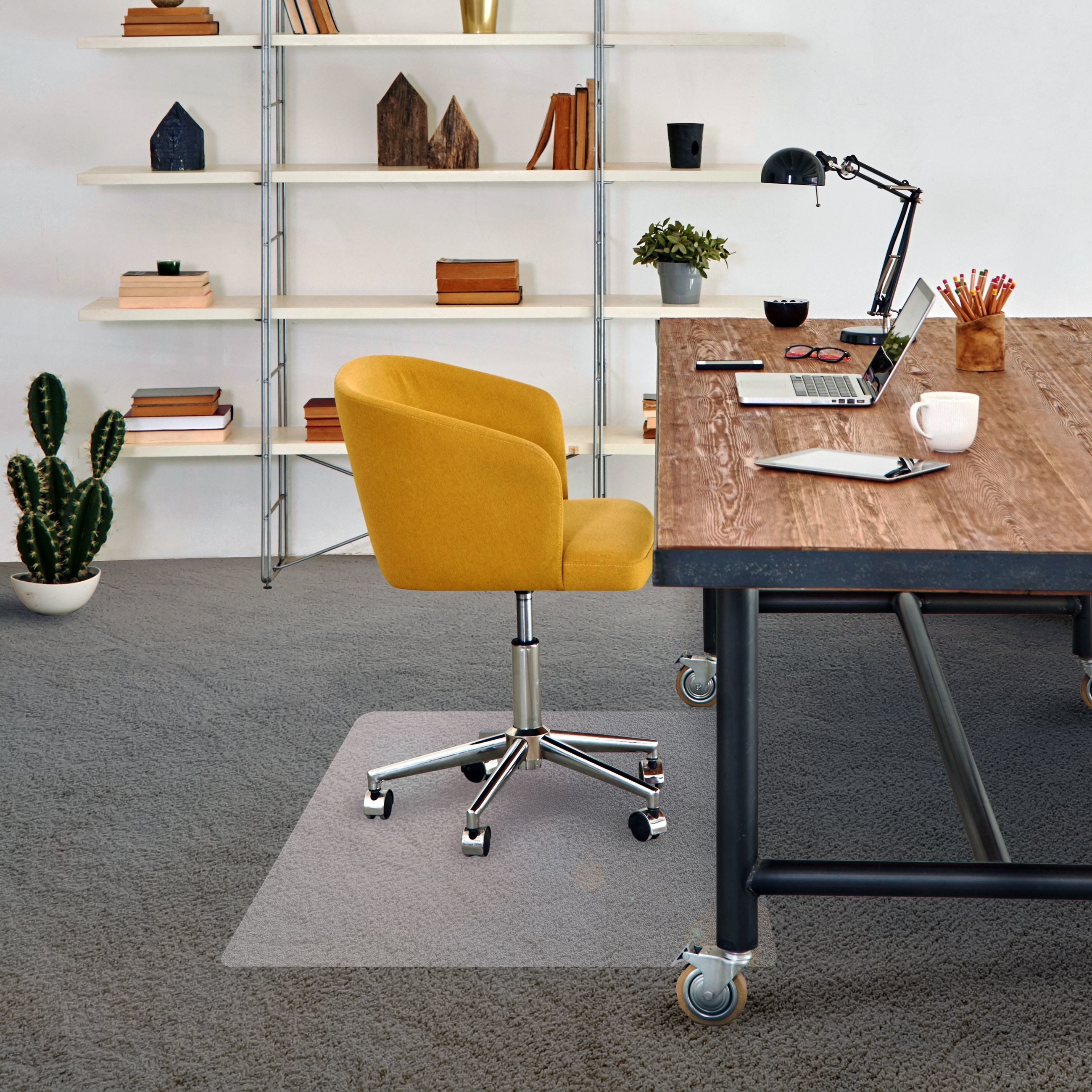 Clear plastic mat with a wheeled chair atop it