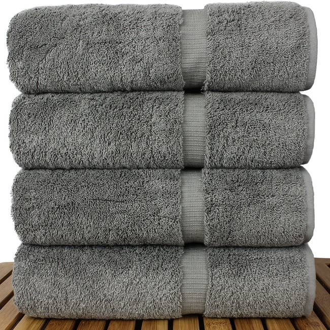 A stack of four gray linen bath towels