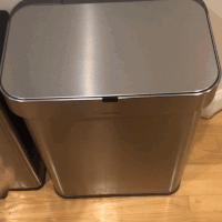 a gif of an editor waving their hand over the garbage can and it opening on its own