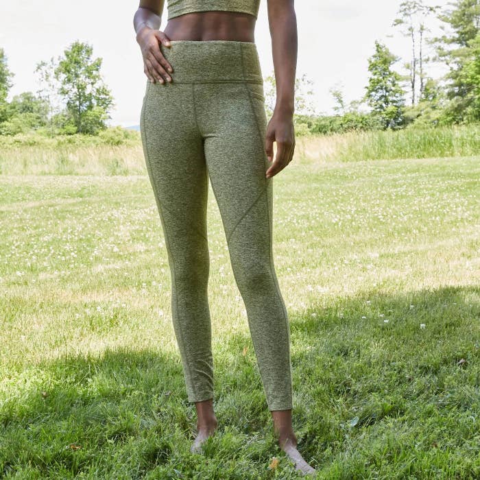 model wearing green high-waisted leggings