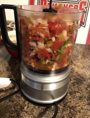 all the chunky ingredients for salsa in the chopper