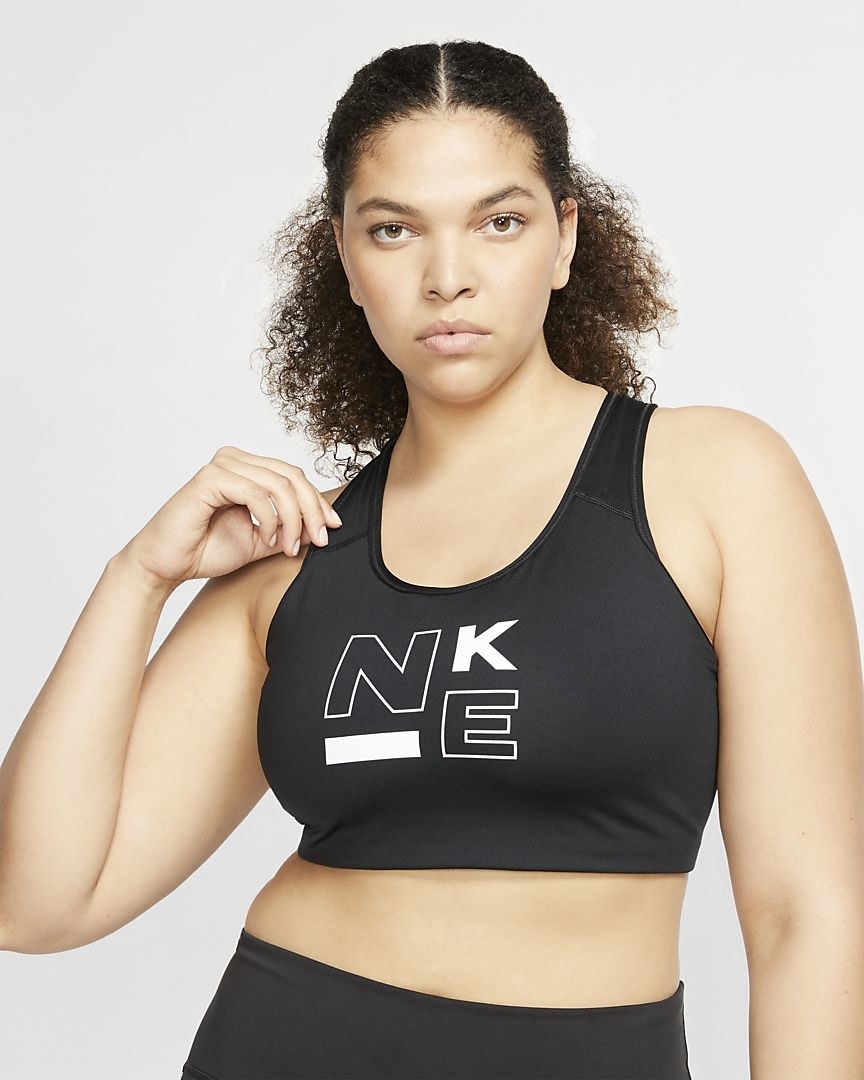 Model in the black sports bra that says Nike on the front