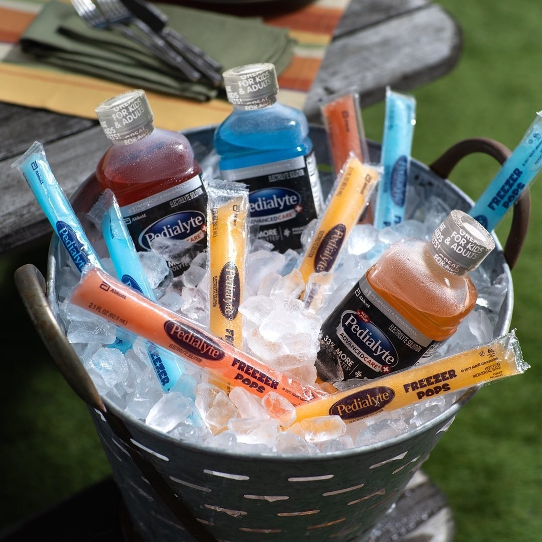 An ice bucket filled with classic Pedialyte and freezies