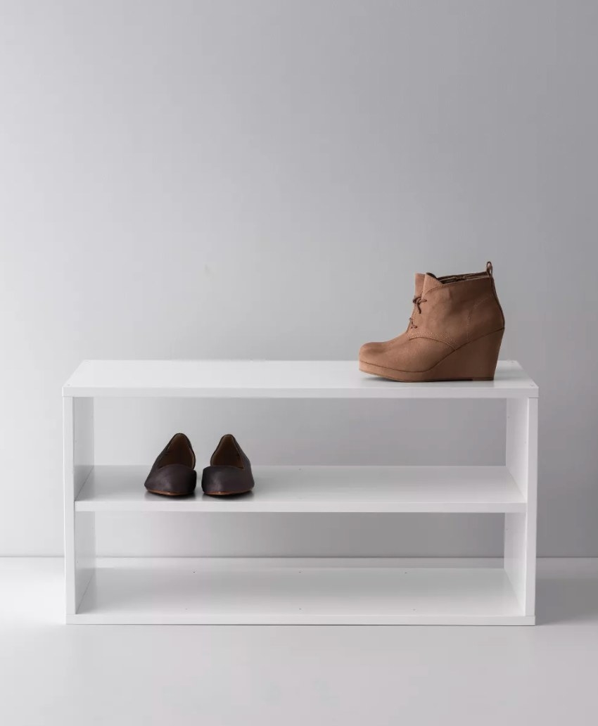 A white shoe shelf with three levels