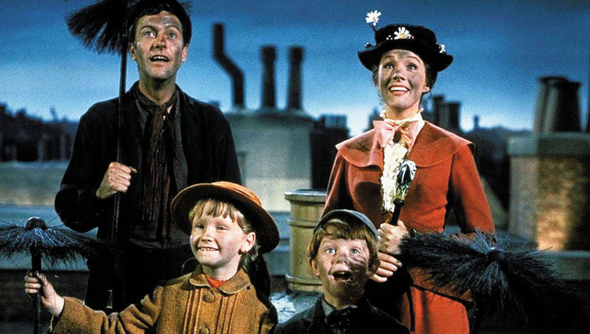 Mary Poppins and her friend Bert (currenty a chimney sweeper but he has many jobs) stand with the children she nannies for