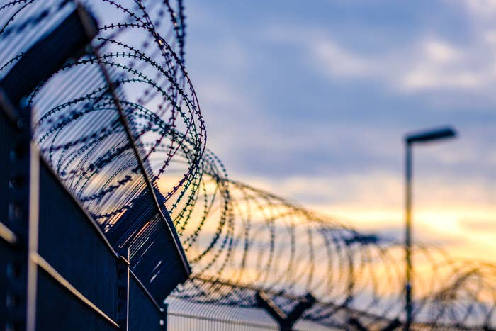 The barbed-wire fence around a prison