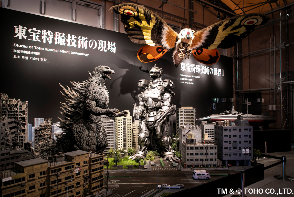 A display of some of Godzilla&#x27;s enemies amongst buildings 