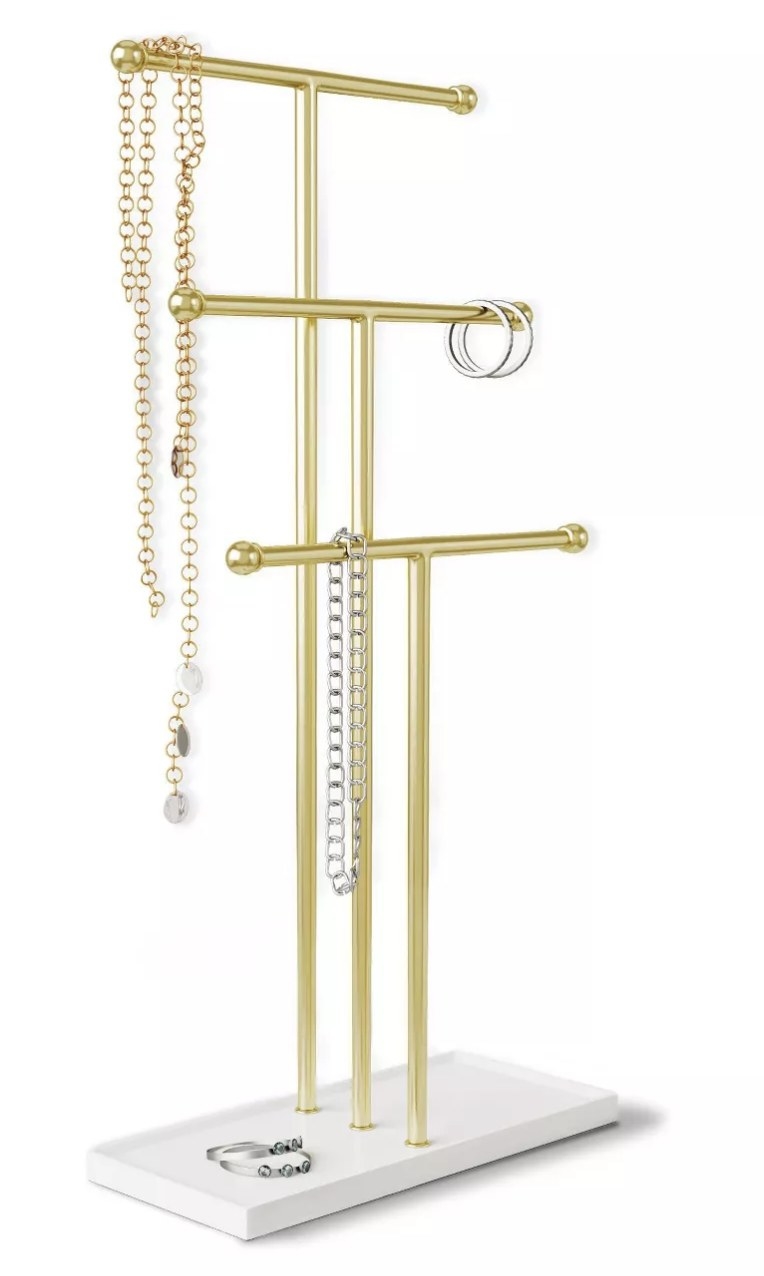 The jewelry organizer displays necklaces and ring storage. 