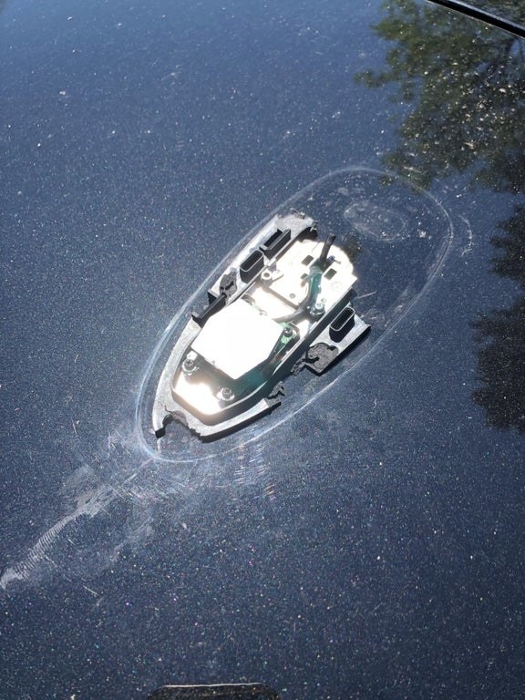 A broken car antenna strongly resembles a boat partially submerged in water