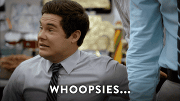Adam Devine in &quot;Workaholics&quot; making a guilty expression. 