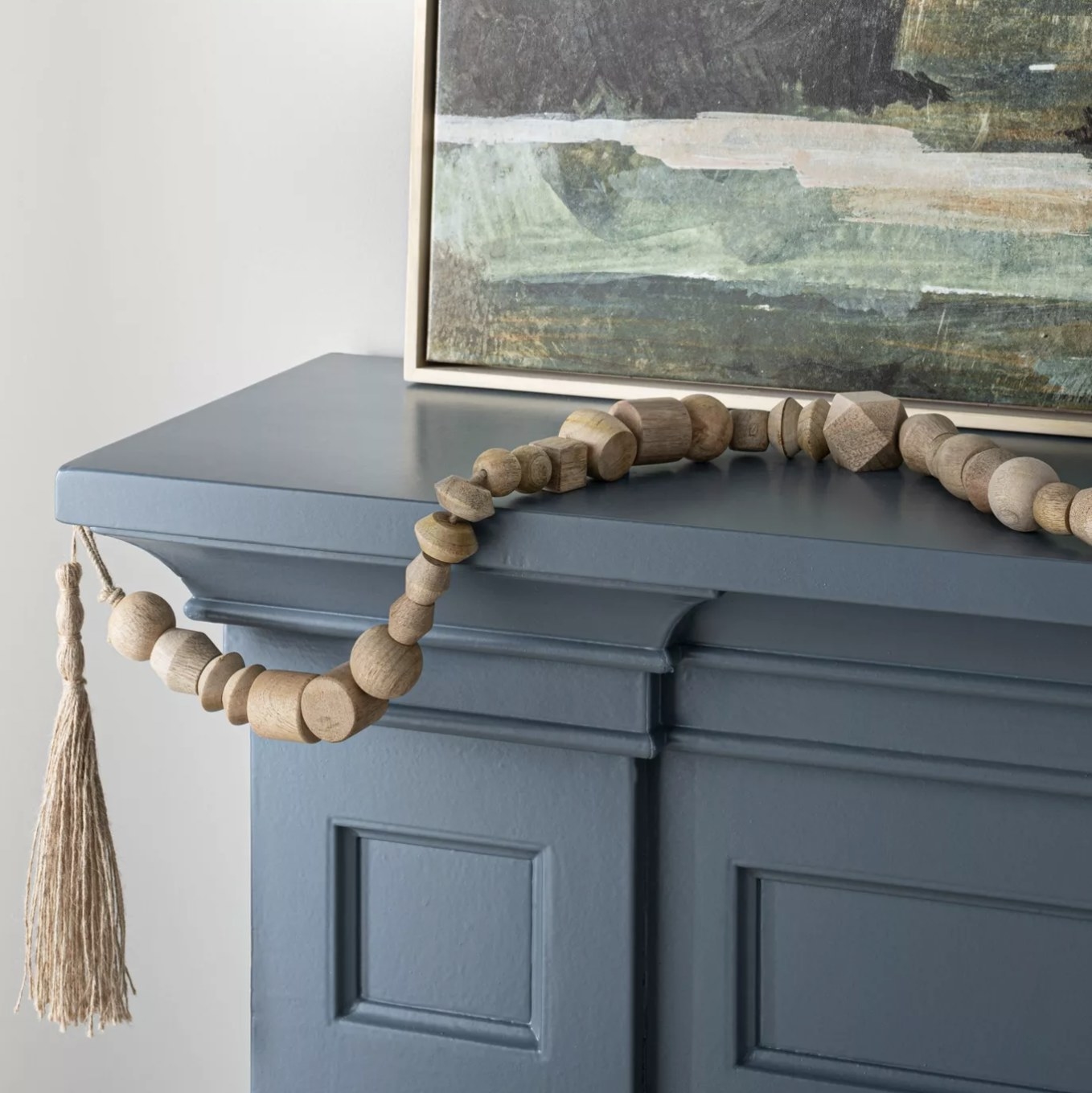 The garland draped over a blue hearth