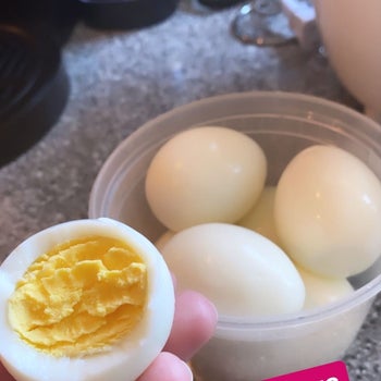 Samantha Wieder showing the inside of a perfectly cooked hard boiled egg