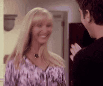 Lisa Kudrow jumps around excitedly as Phoebe in &quot;Friends.&quot;