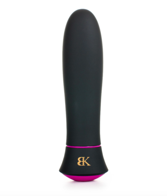 A tiny black and pink waterproof massager with Bedroom Kandi&#x27;s logo on the front