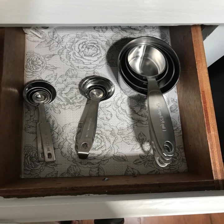 inside of a reviewer's drawer lines with grey and white floral liner