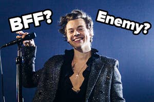 Harry Styles smiles charmingly with questions next to his head that read enemy or bff?