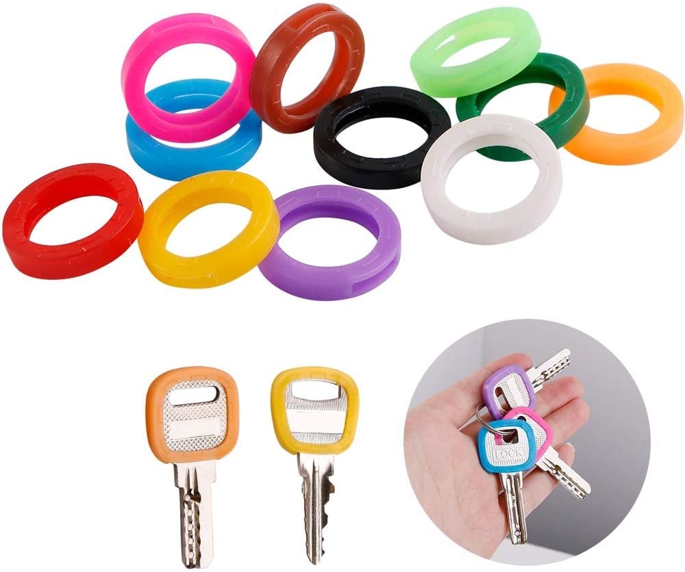 A bunch of round plastic key covers in different colours
