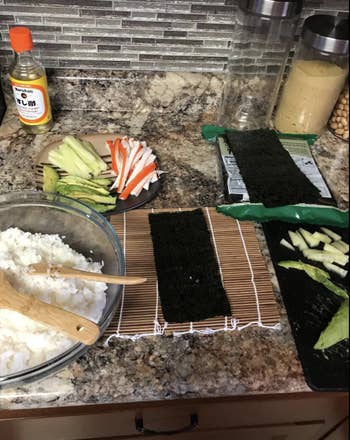 Reviewer's ingredients for sushi laid out with sushi rolling mat 