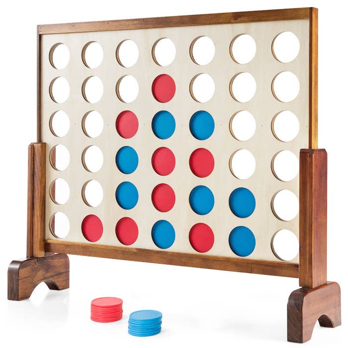 The Costway Giant 4 in a Row Game with red and blue circular pieces