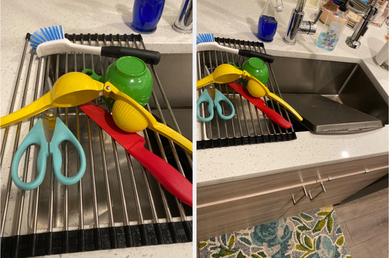 A metal grated dish drying rack with black rubber edges over a sink