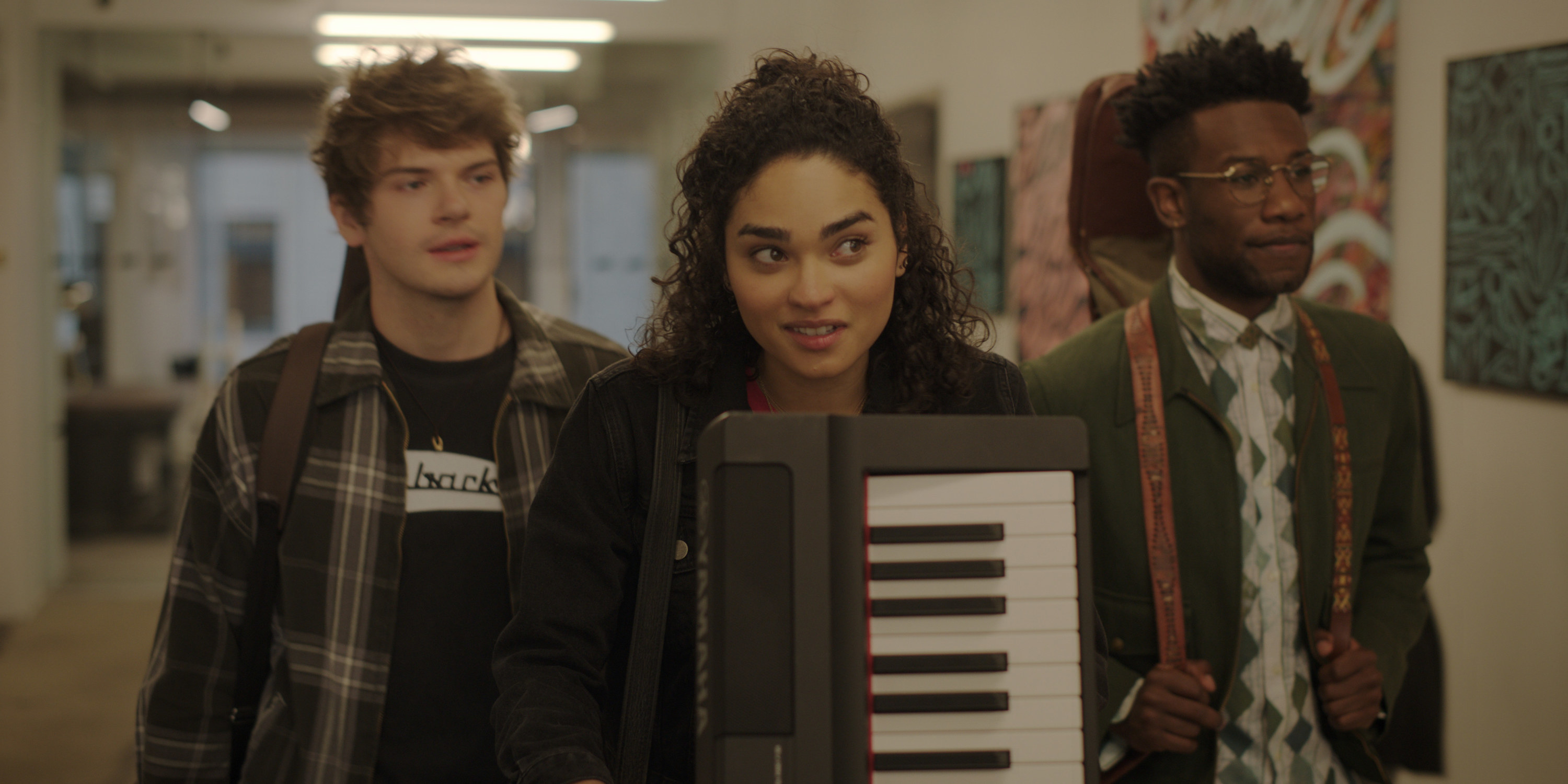 Samuel, Bess, and Benny carting their instruments to an audition for a record label