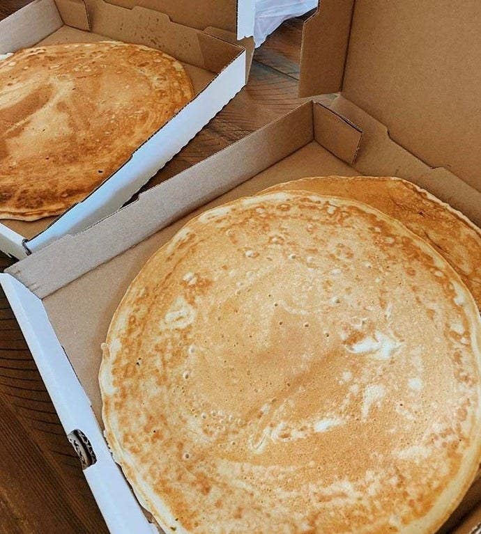 Large pancakes in the type of boxes pizza traditionally comes in
