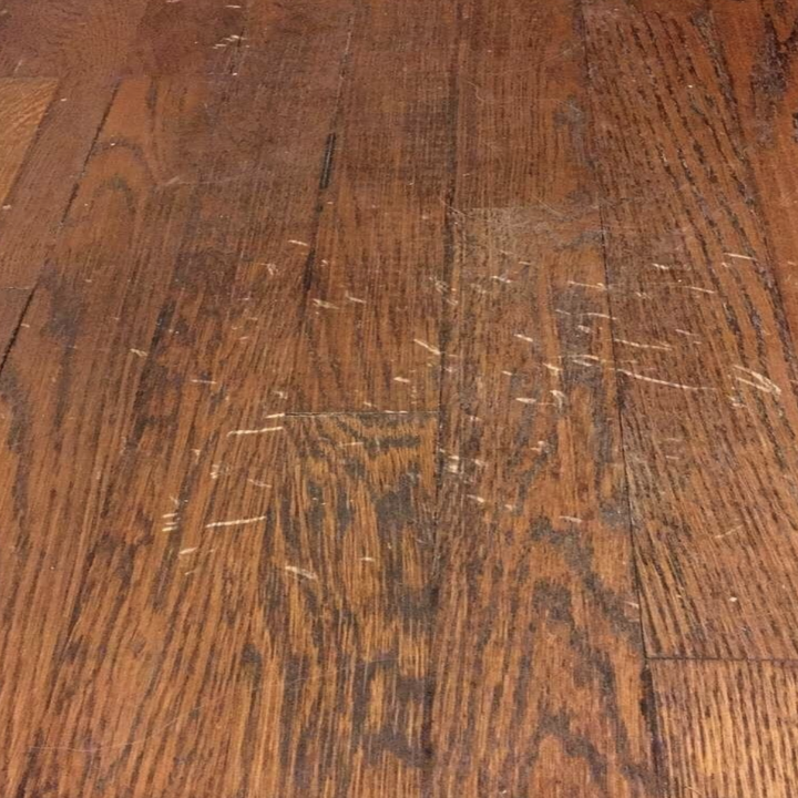 Reviewer's scratched wood floor 