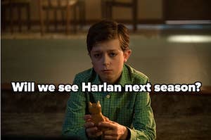Harlan from Umbrella Academy looks forlornly at a cat figurine