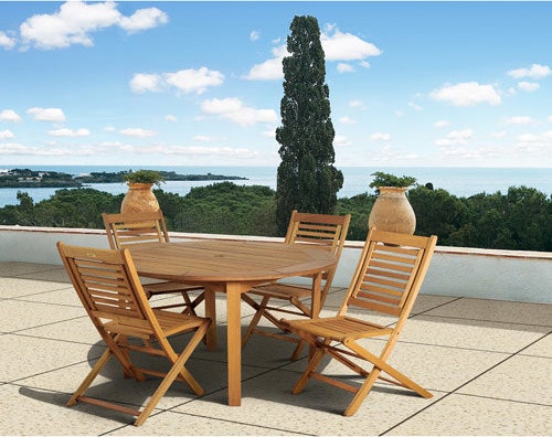 The Milano FSC Eucalyptus Wood 5-Piece Round Patio Dining Set with 4 Folding Chairs on an outdoor patio