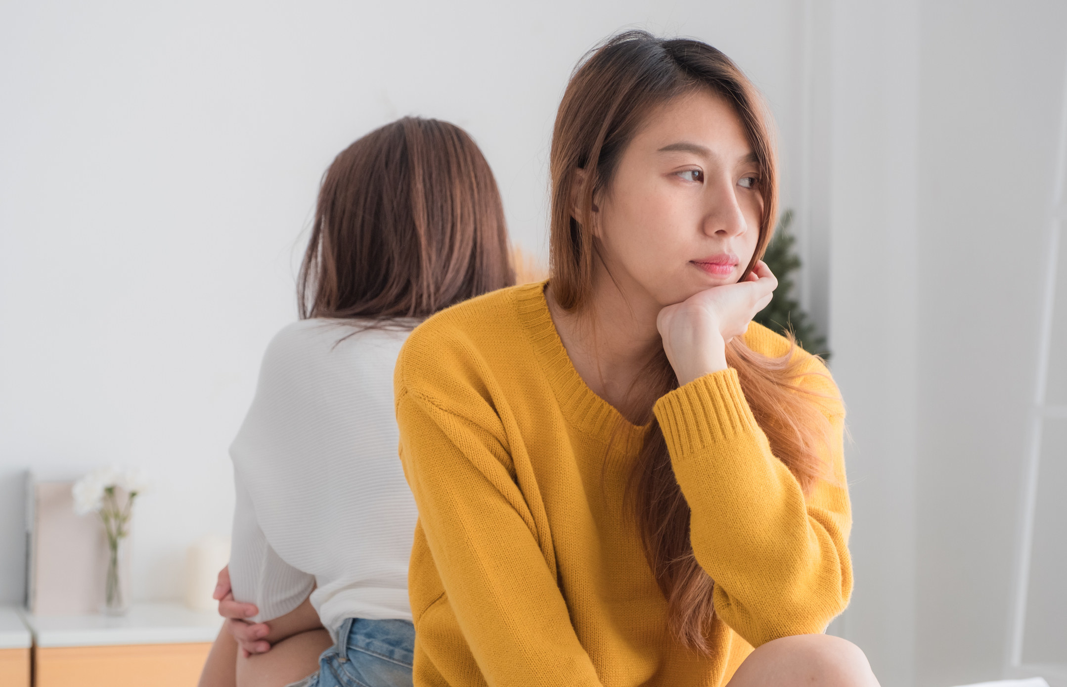 Women facing away from each other