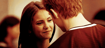 Stefan and Elena smiling at each other