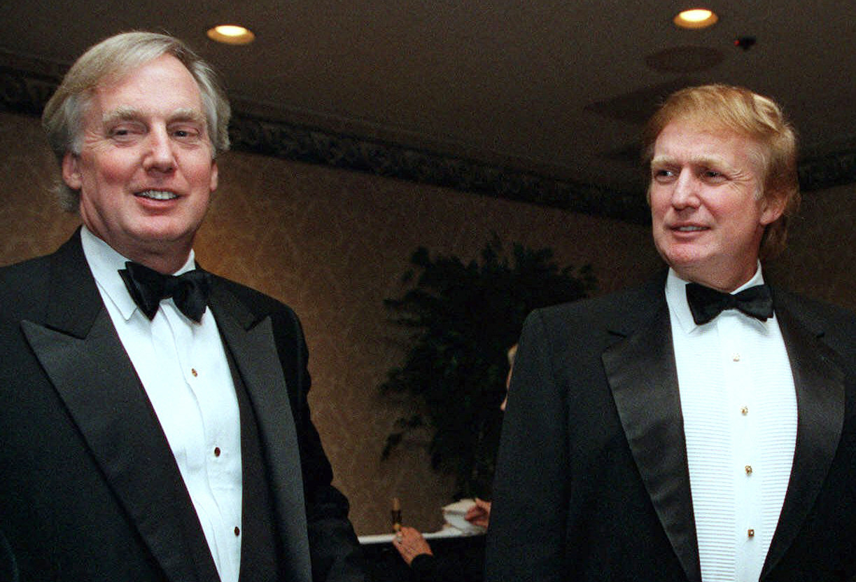 Donald Trump and Robert Trump are smiling while dressed in tuxedos