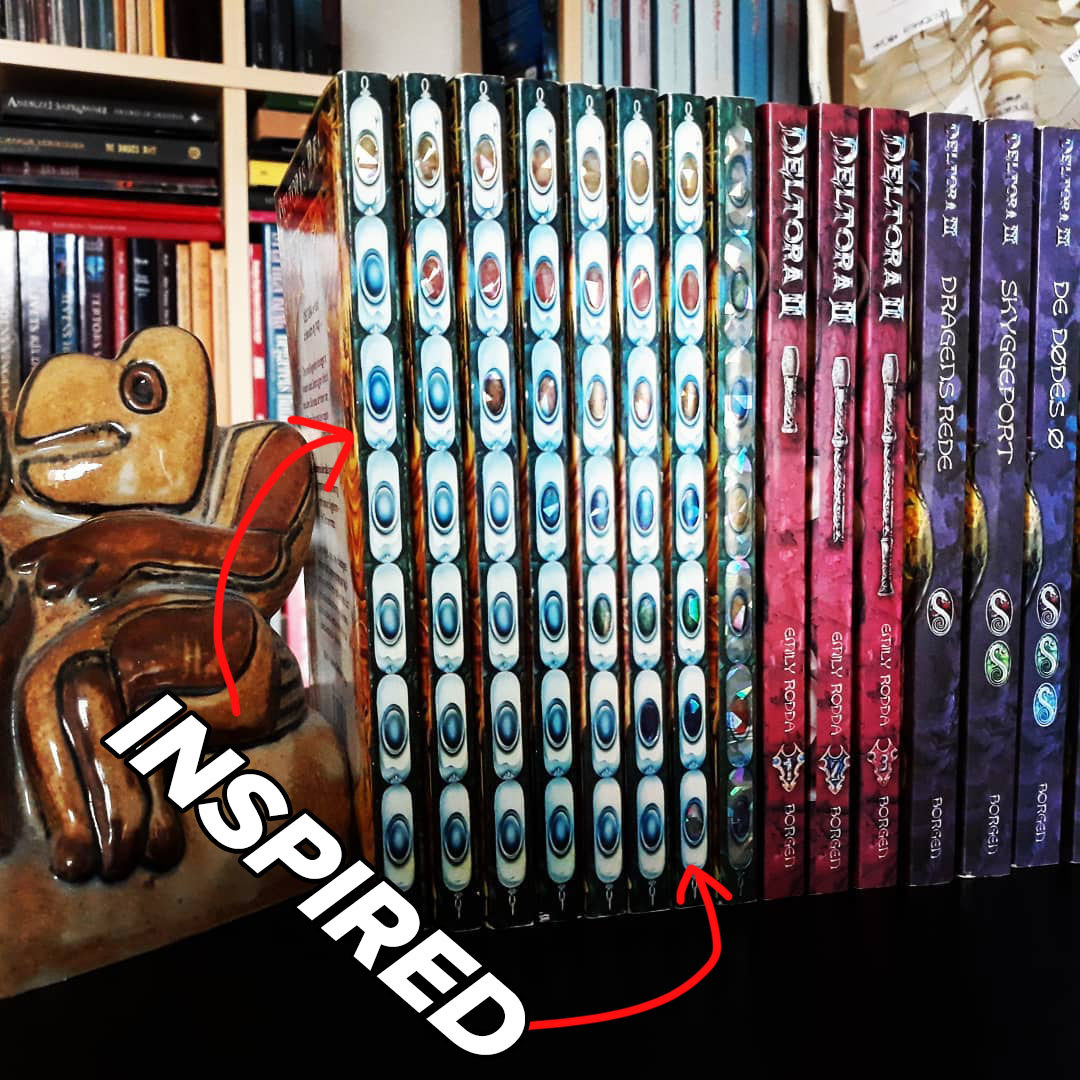 The books spines of the Deltora Quest series, showing the gemstones. 