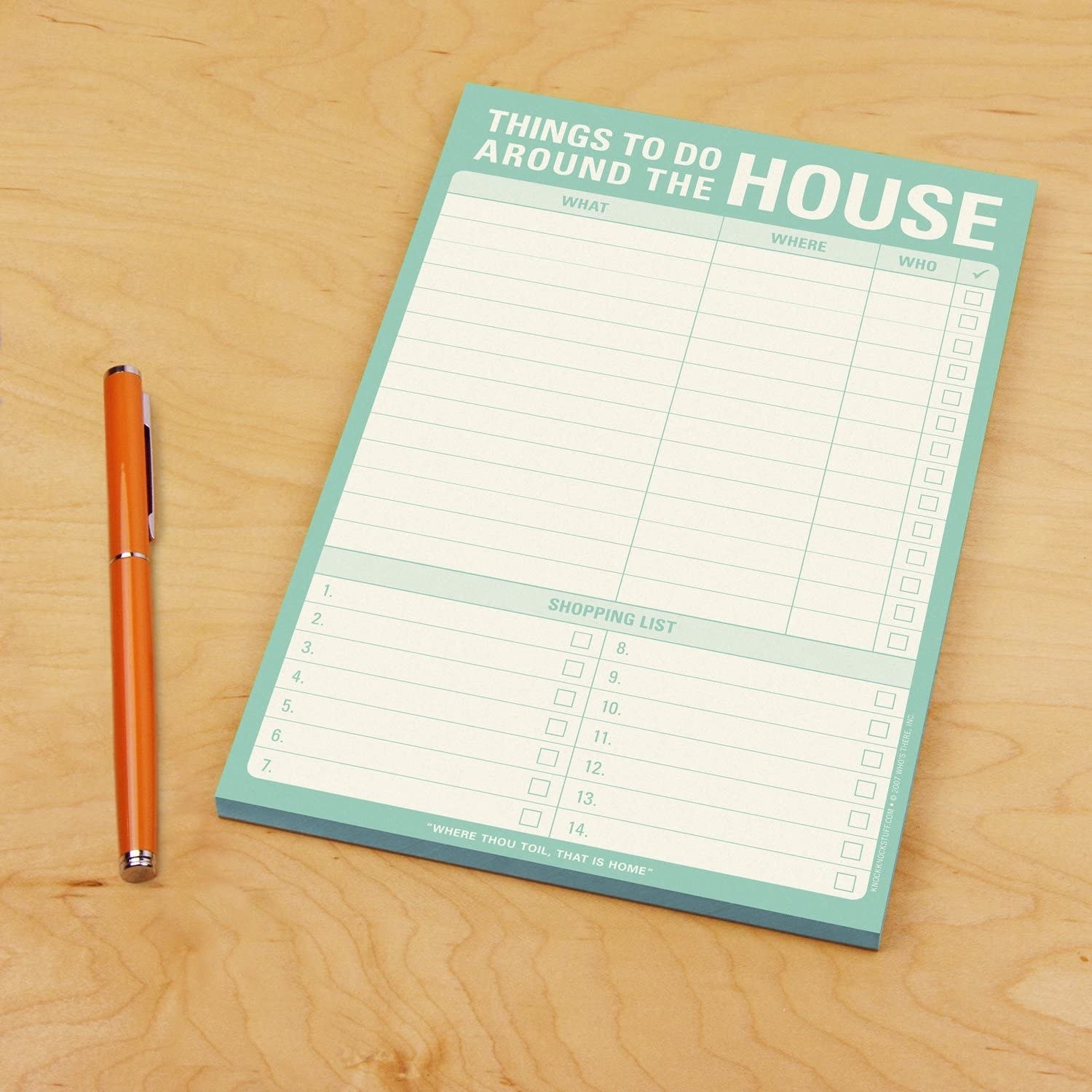 A chore checklist on a table with a pen next to it