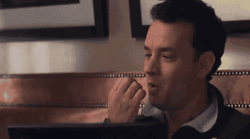 Tom Hanks exuberantly typing in You&#x27;ve Got Mail 
