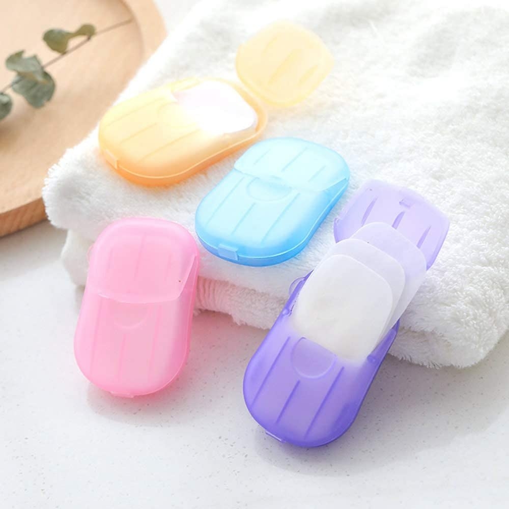 Four open containers with the soap sheets spilling out