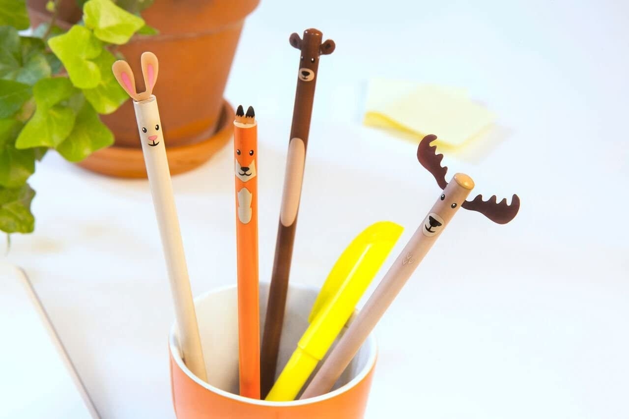 Four woodland critter pencils in a colourful cup