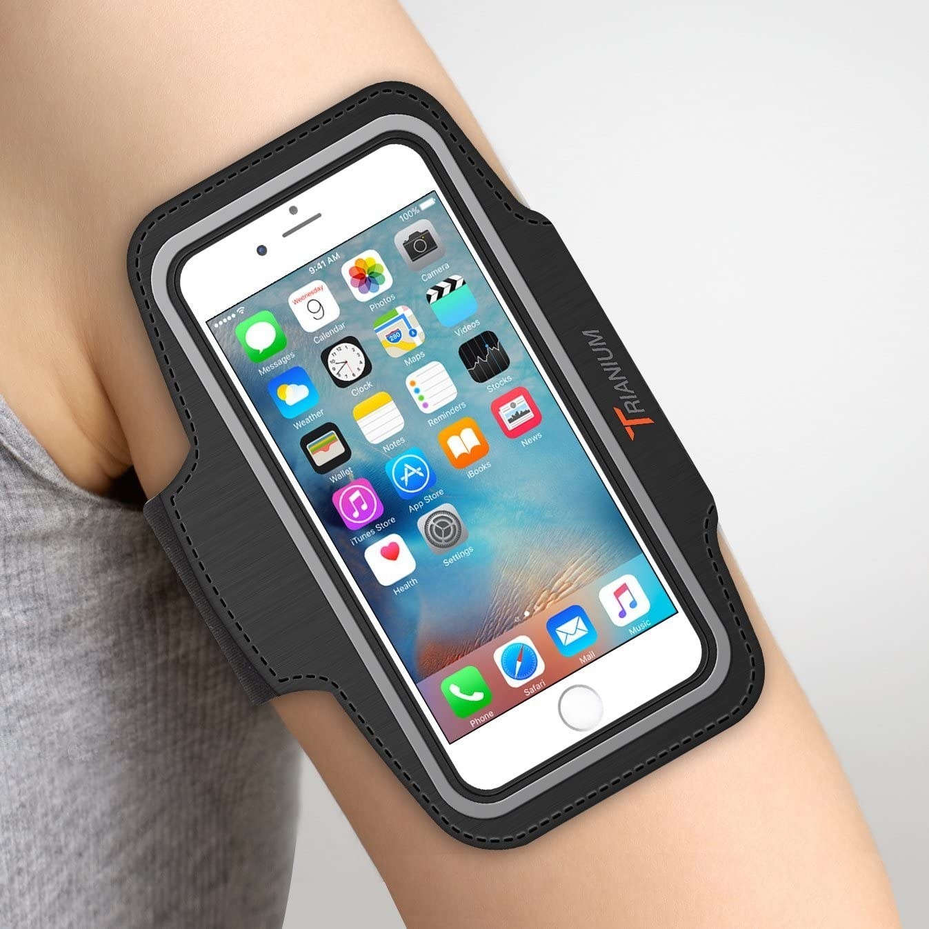 Someone&#x27;s arm with an iPhone in the armband case.