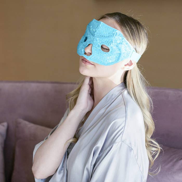 A person relaxes with the gel eye mask