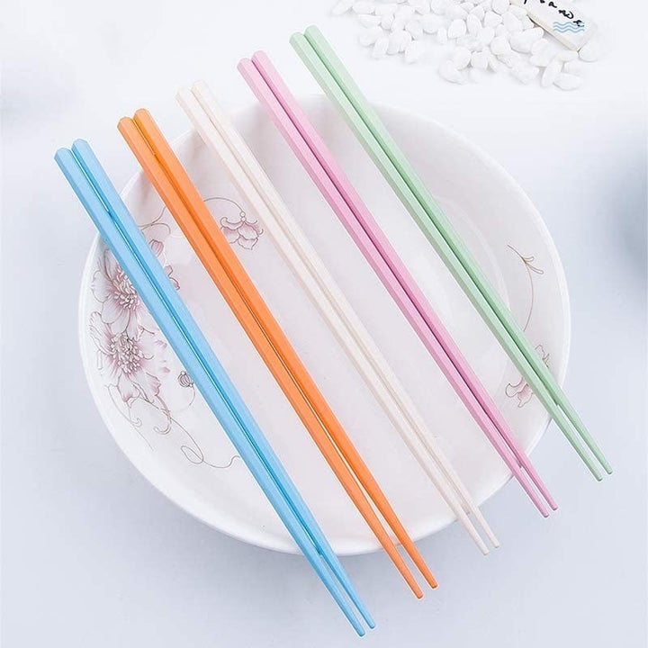 A flatlay of the chopsticks neatly arranged on a bowl