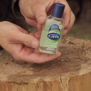 Starting a fire with hand sanitizer. 