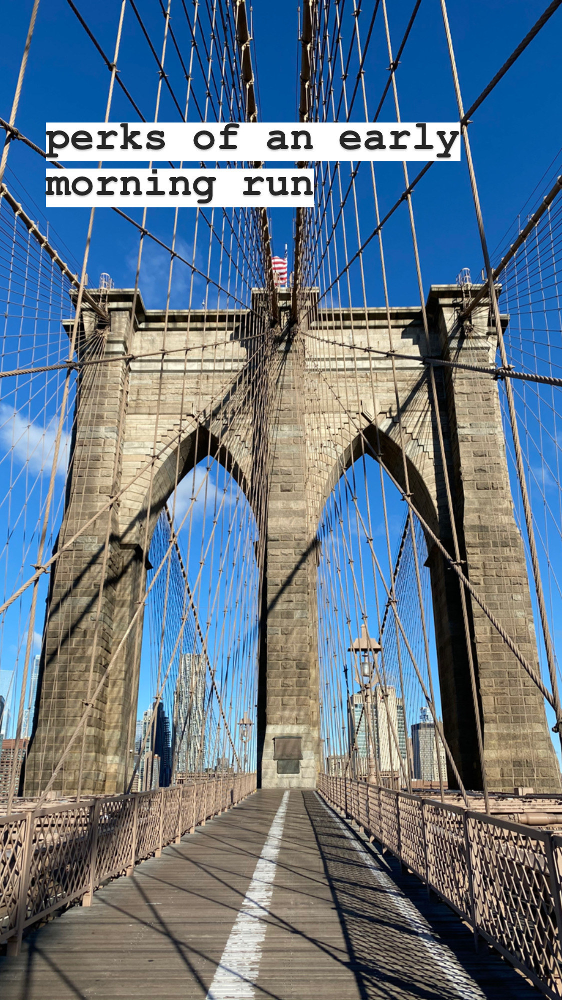 The Brooklyn Bridge in the morning, completely empty of pedestrians.